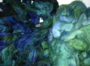 Cotton rayon warp threads and Wool roving being rinsed in the sink.