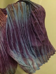 pleats of a shibori dyed silk scarf at slowyarn.com