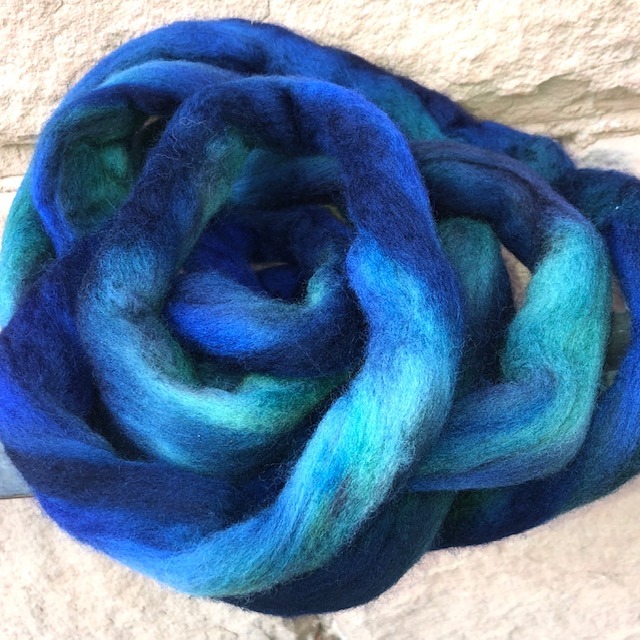 dried dyed wool roving showing bright color changes