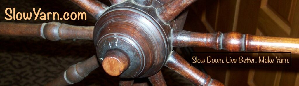 the hub of an antique spinning wheel