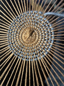 the center weaving on a mandala tapestry